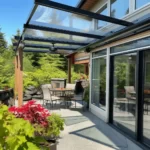 glass patio cover with a fan in kelowna
