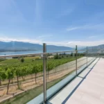 glass railing overlooking a vineyard in the Okanagan 