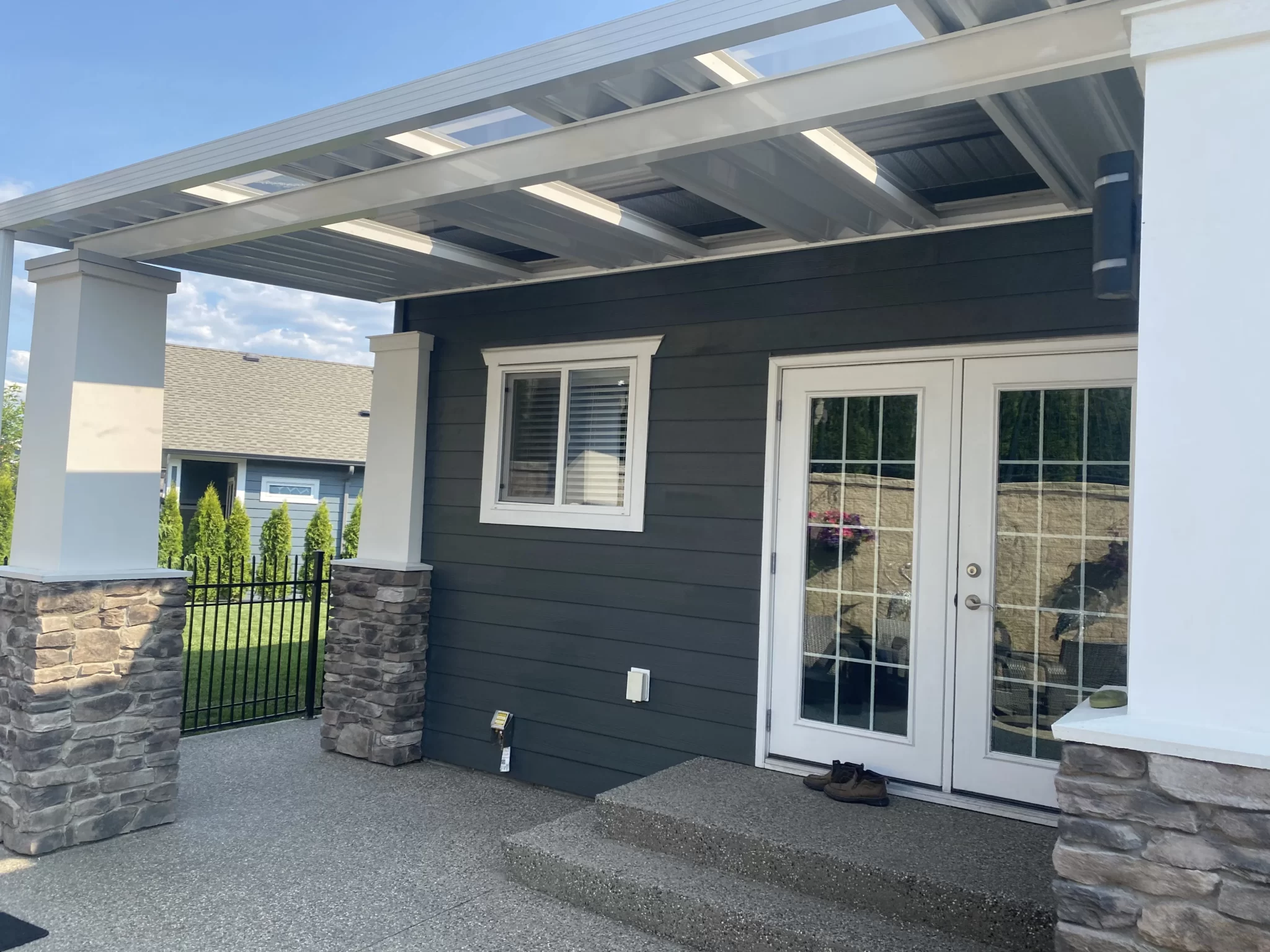 Sloped aluminum patio roof on Kelowna home