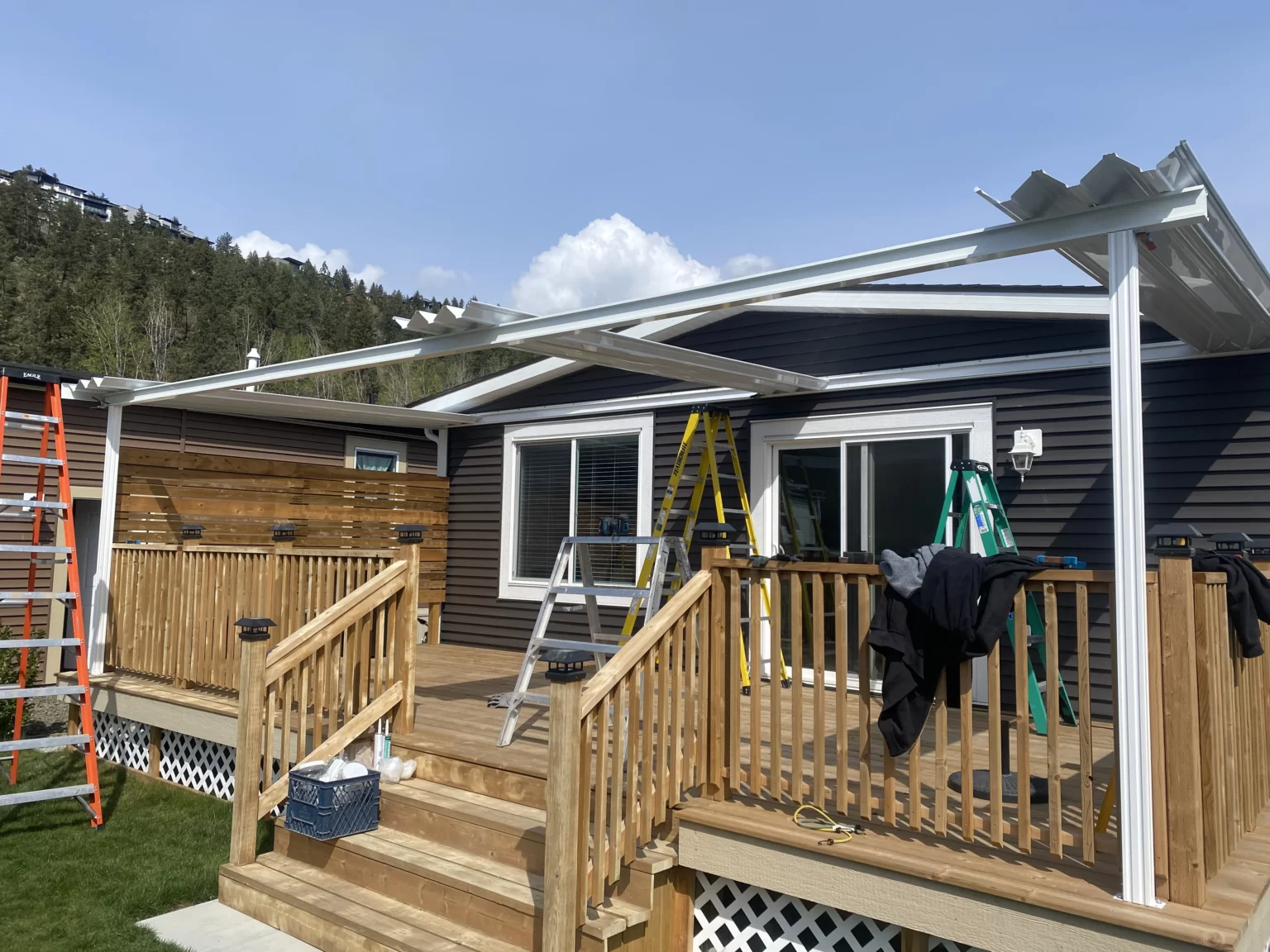 Okanagan patio cover installers installing an aluminum patio cover on a Kelowna home