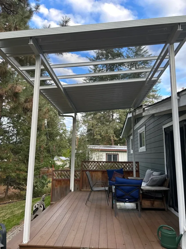 Combination aluminum and glass patio cover over a deck in West Kelowna
