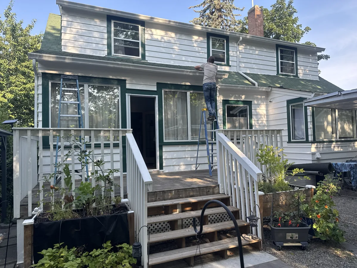 Aluminum patio cover installation in progress on a raised deck of a Kelowna home