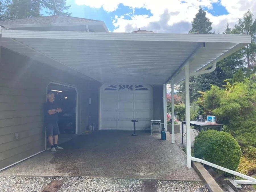 White aluminum patio cover over a driveway carport in Kelowna